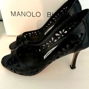 Manolo Blahnik black leather open toe with beautiful cut outs.